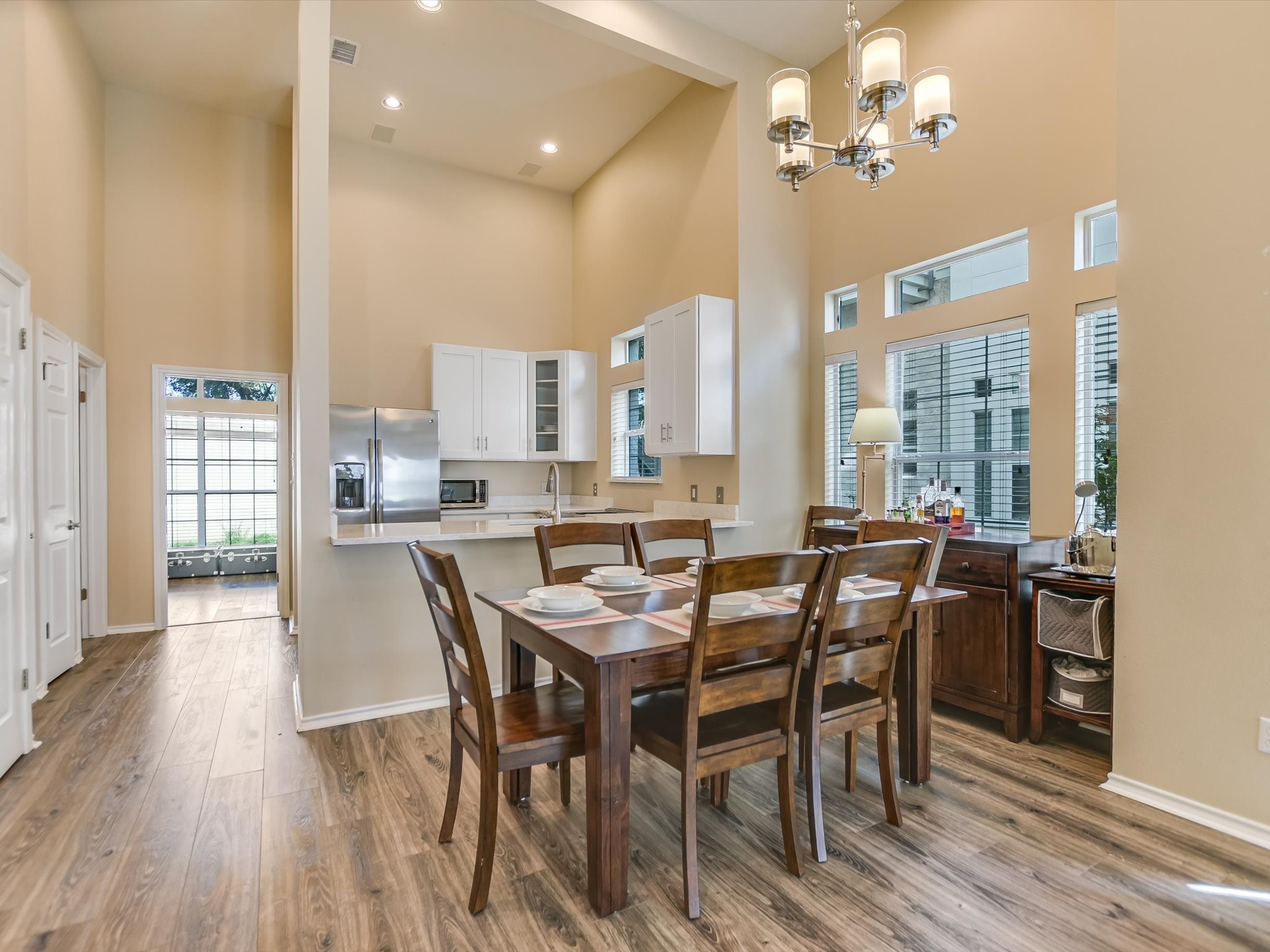 2918 Ranch Road 620 North, Unit X205 Austin, TX 78734 - Photo 5 of 23 a view of a dining room with furniture window and wooden floor