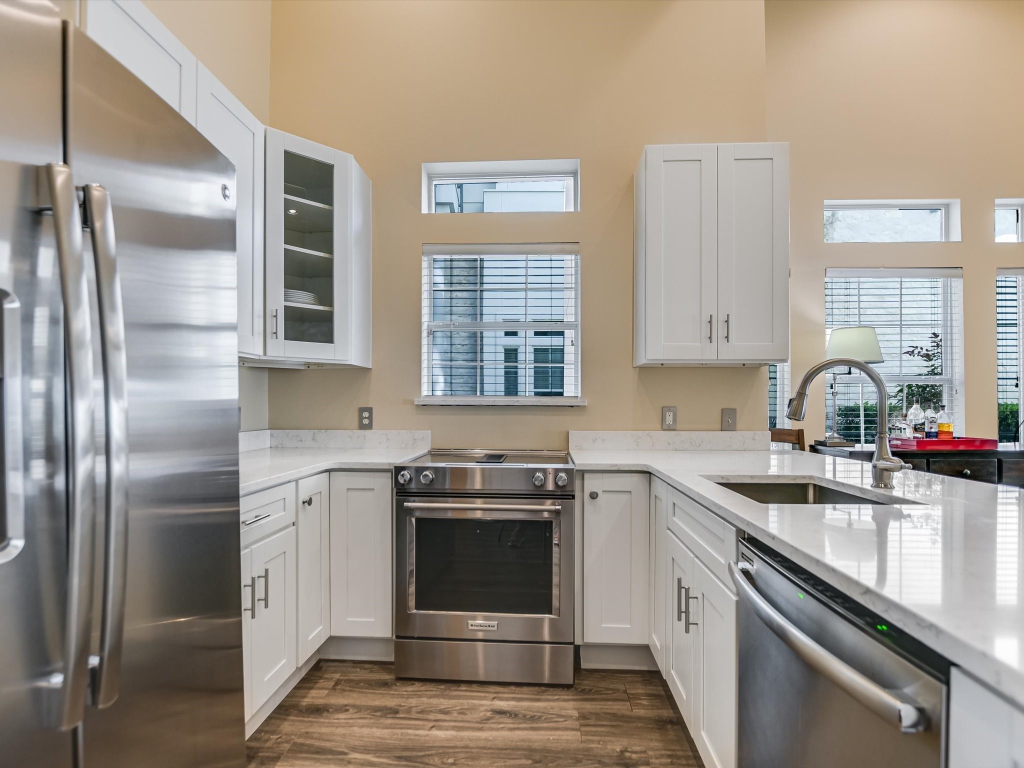 2918 Ranch Road 620 North, Unit X205 Austin, TX 78734 - Photo 6 of 23 a kitchen with stainless steel appliances granite countertop a sink stove and refrigerator