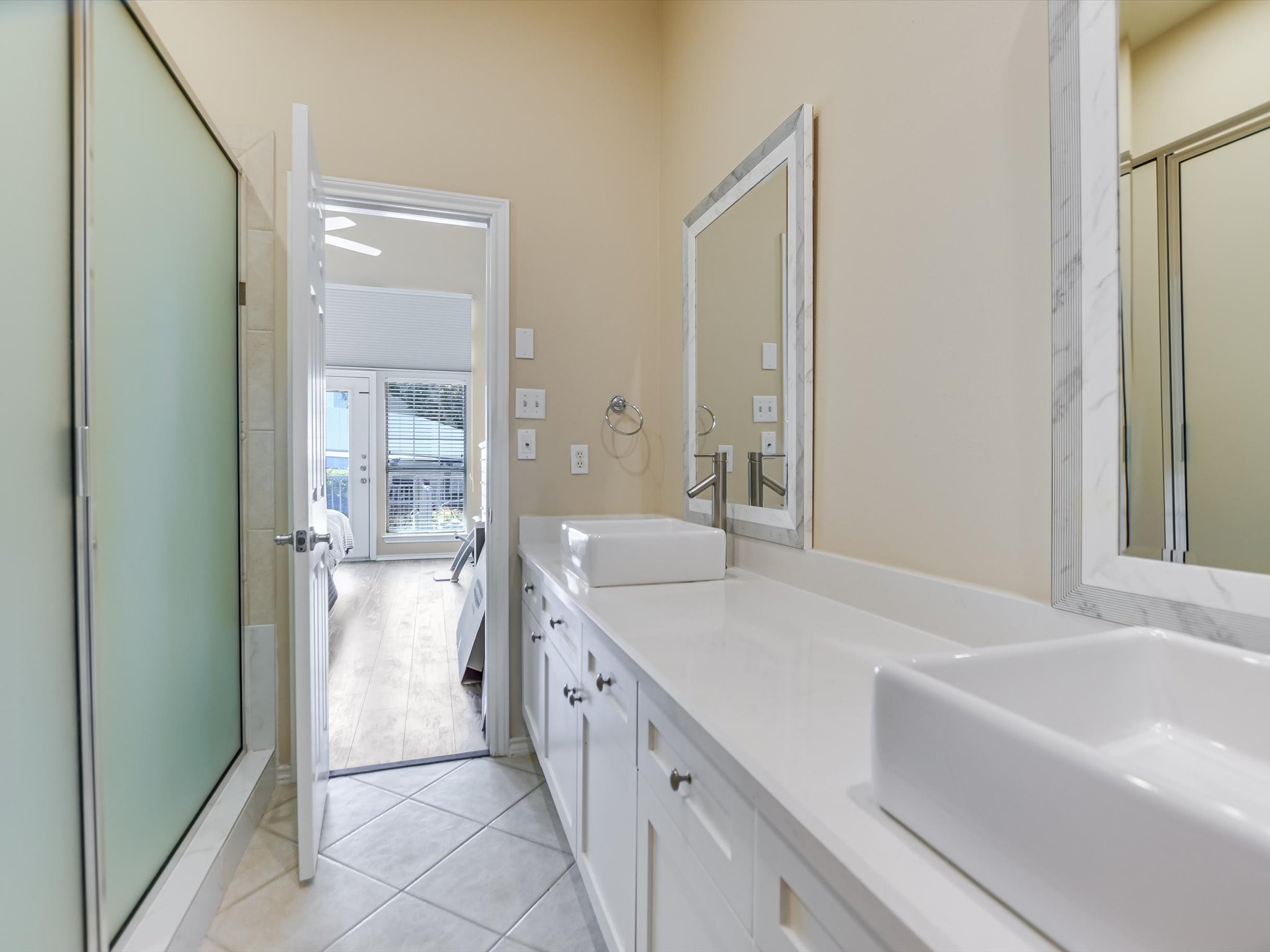 2918 Ranch Road 620 North, Unit X205 Austin, TX 78734 - Photo 9 of 23 a bathroom with a tub sink and mirror