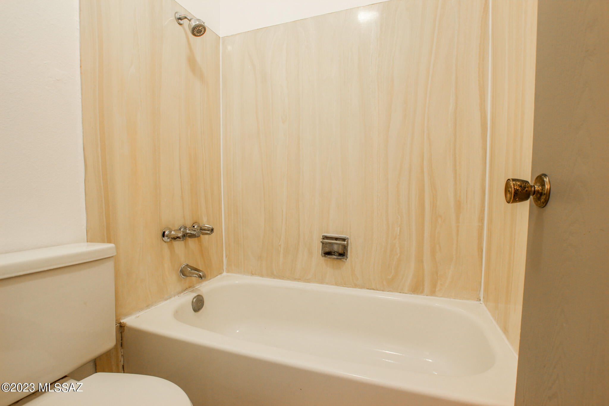 1063 East Halcyon Road Tucson, AZ 85719 - Photo 13 of 35 a white bath tub sitting next to a toilet