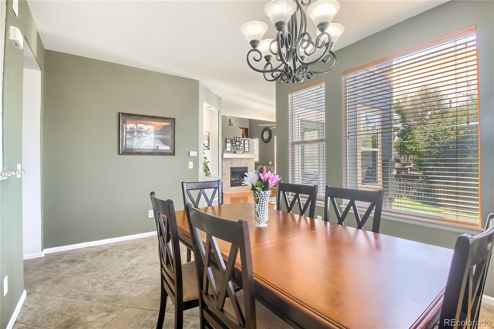 10861 Brooklawn Road Highlands Ranch, CO 80130 - Photo 11 of 30 a view of a dining room with furniture window and outside view