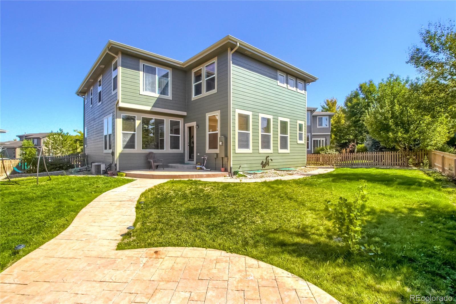 10861 Brooklawn Road Highlands Ranch, CO 80130 - Photo 24 of 30 a front view of a house with a yard