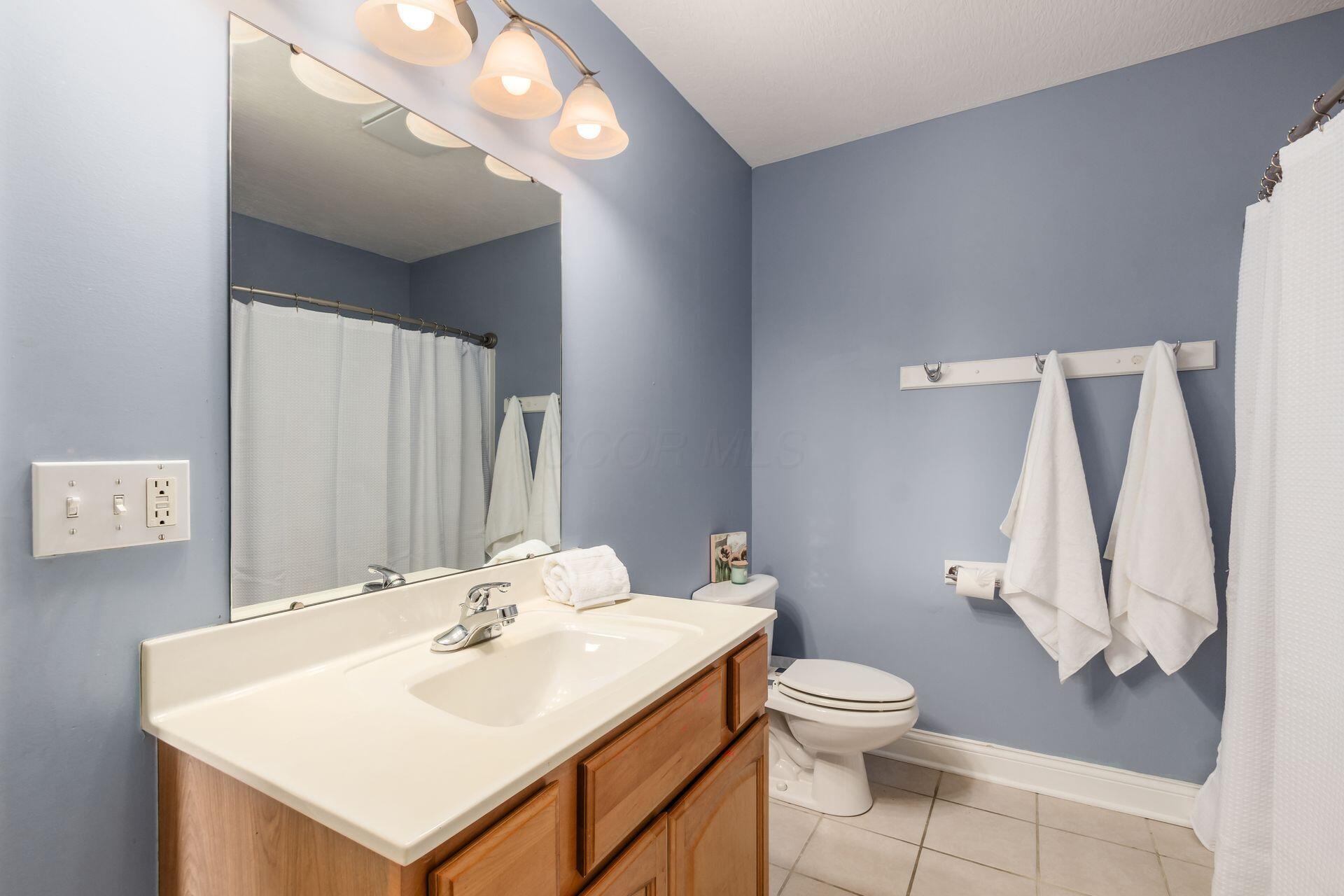 2467 Roe Drive Lewis Center, OH 43035 - Photo 30 of 50 Bedrooms share the hall full bathroom with convenient laundry space.