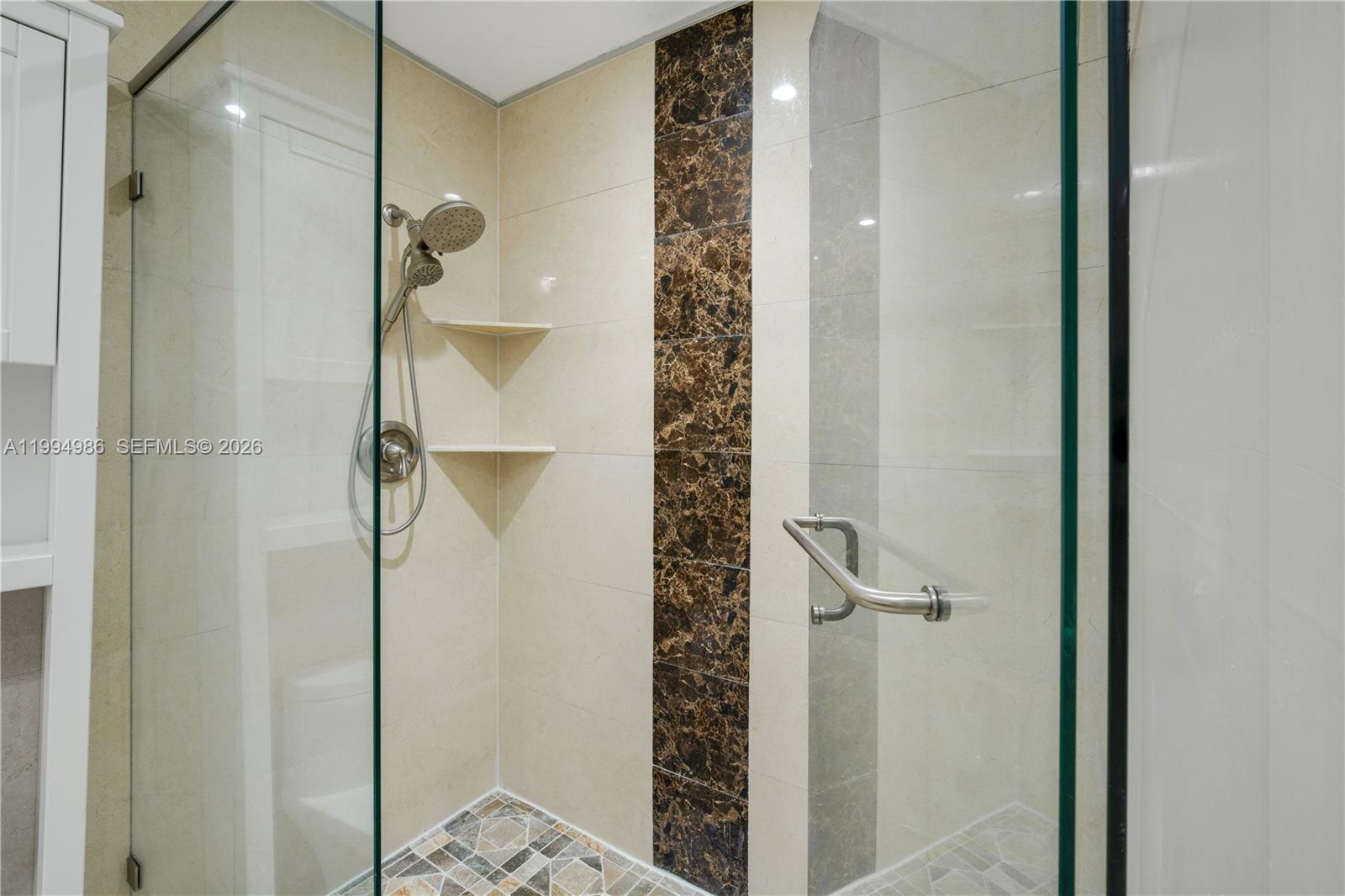 15250 Southwest 154th Terrace, Unit A Miami, FL 33187 - Photo 12 of 16 a bathroom with a shower