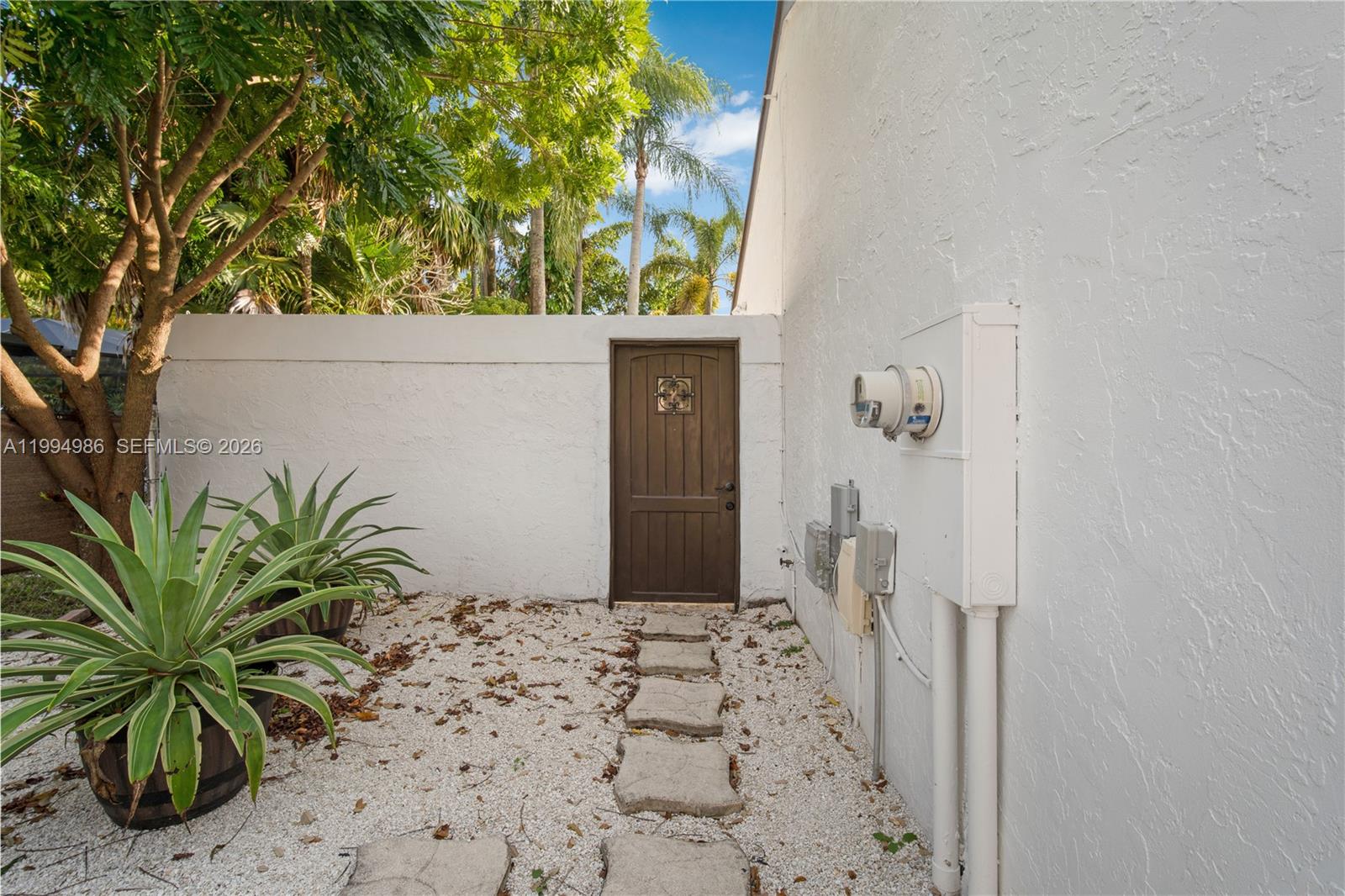 15250 Southwest 154th Terrace, Unit A Miami, FL 33187 - Photo 3 of 16 a view of a wooden door