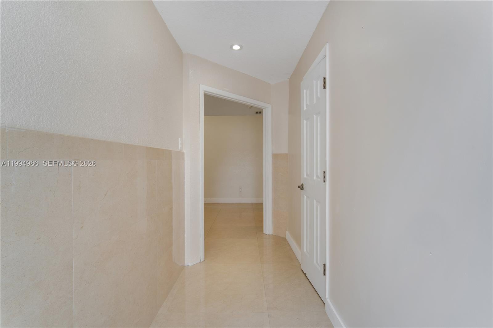 15250 Southwest 154th Terrace, Unit A Miami, FL 33187 - Photo 6 of 16 a view of a hallway