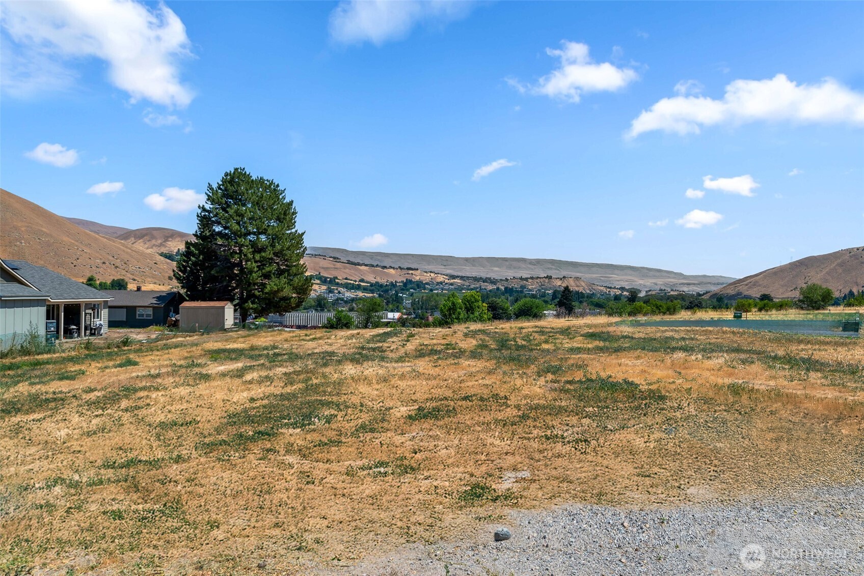 37 Penstemon Lane Monitor, WA 98836 - Photo 16 of 16 a view of a lake with a house in the background