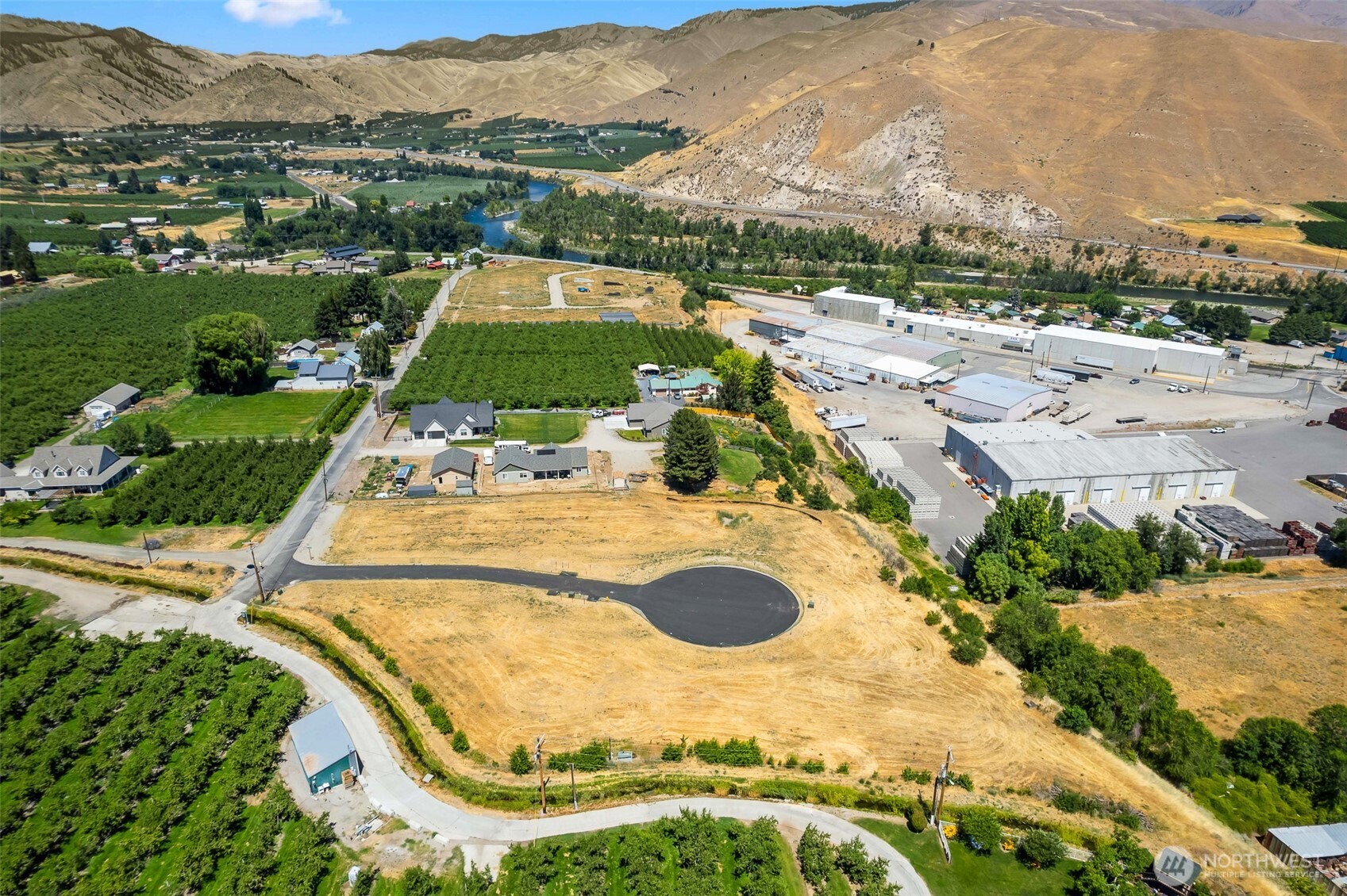 37 Penstemon Lane Monitor, WA 98836 - Photo 3 of 16 a view of a swimming pool with a yard