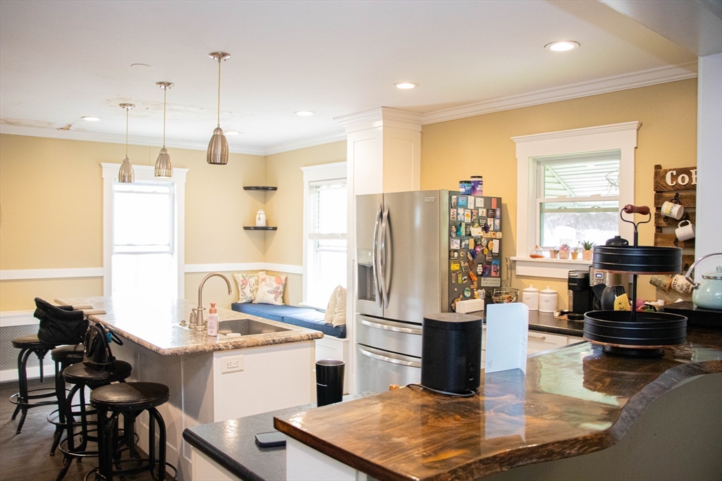 85-87 Slater Street Webster, MA 01570 - Photo 4 of 41 a kitchen with refrigerator and stove