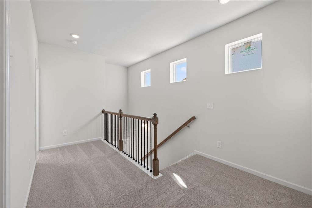 1007 Stiles Court, Unit 48 Cartersville, GA 30120 - Photo 15 of 34 a view of a hallway with a window