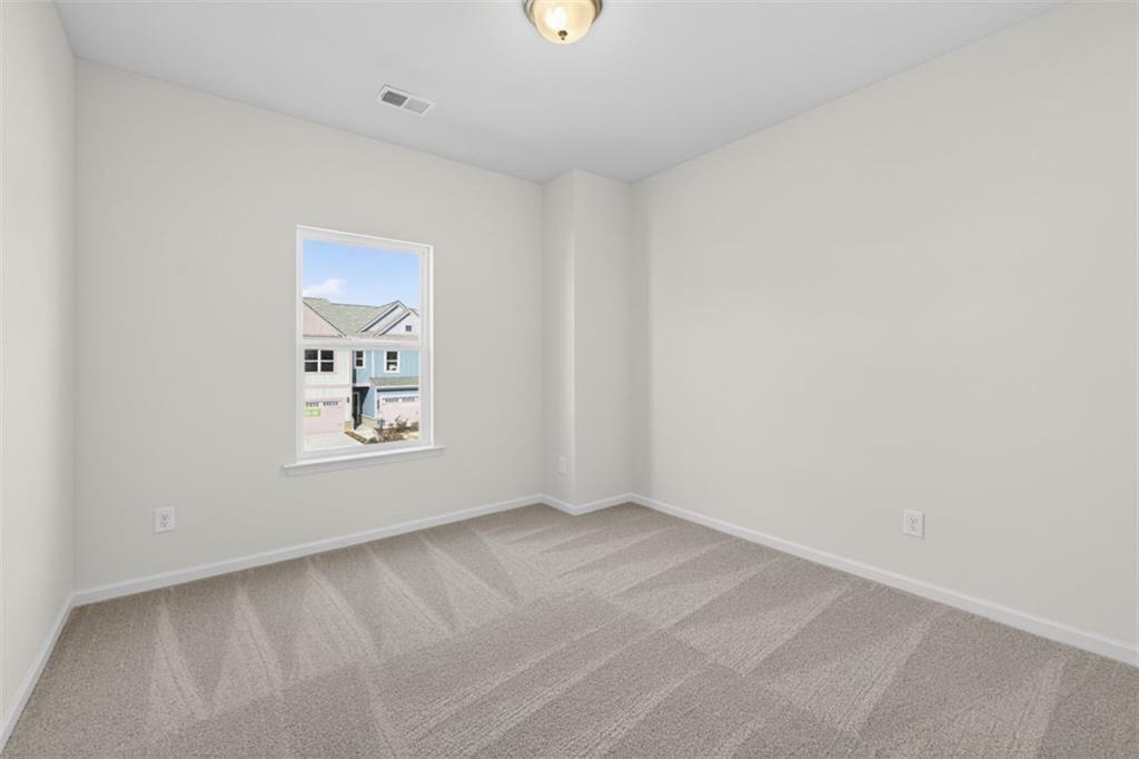 1007 Stiles Court, Unit 48 Cartersville, GA 30120 - Photo 16 of 34 a view of an empty room with a window