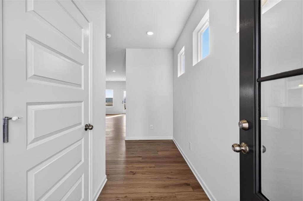 1007 Stiles Court, Unit 48 Cartersville, GA 30120 - Photo 2 of 34 a view of a hallway with wooden floor and staircase
