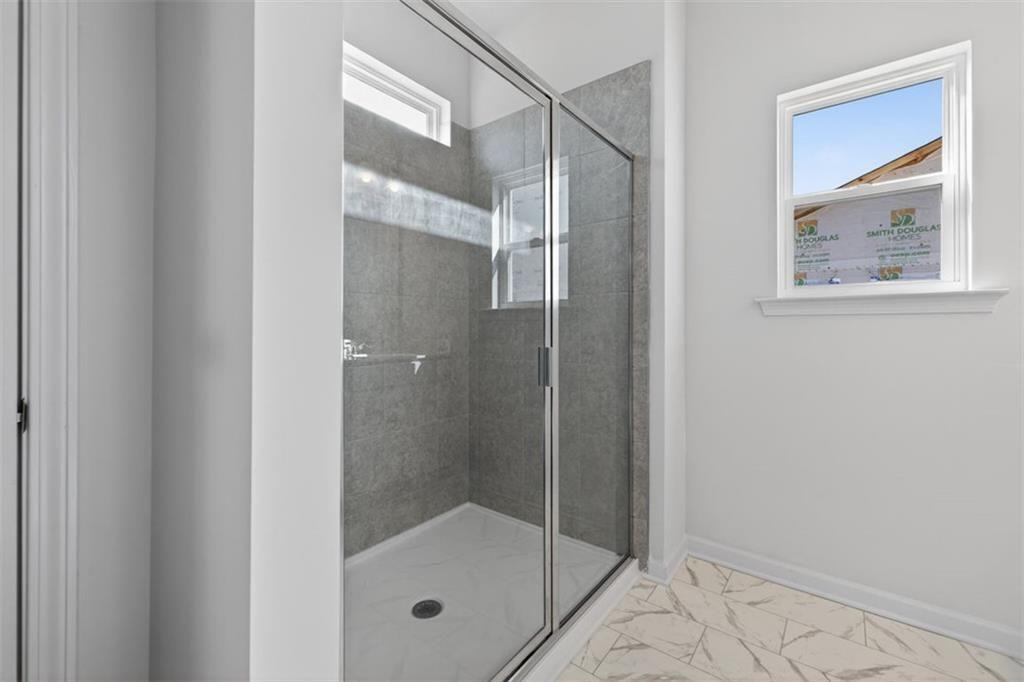 1007 Stiles Court, Unit 48 Cartersville, GA 30120 - Photo 29 of 34 a bathroom with a glass shower door