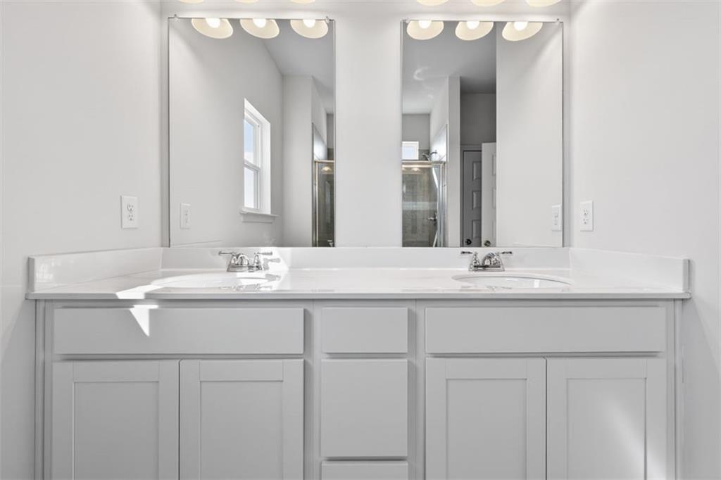 1007 Stiles Court, Unit 48 Cartersville, GA 30120 - Photo 30 of 34 a bathroom with a sink and a mirror