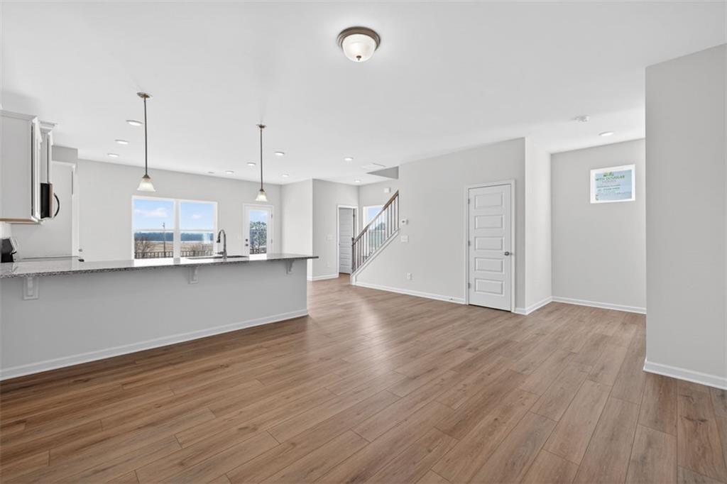 1007 Stiles Court, Unit 48 Cartersville, GA 30120 - Photo 6 of 34 a view of a kitchen with wooden floor and windows