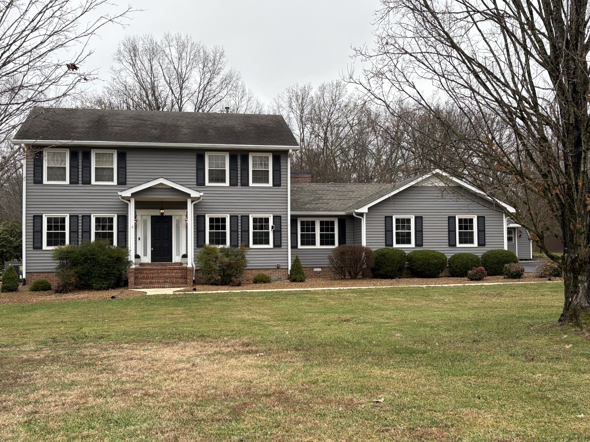 703 12 Oaks Road Tullahoma, TN 37388 - Photo 1 of 46 a front view of a house with a yard