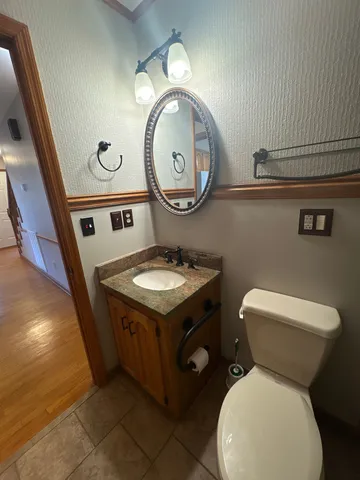 a bathroom with a toilet and a sink