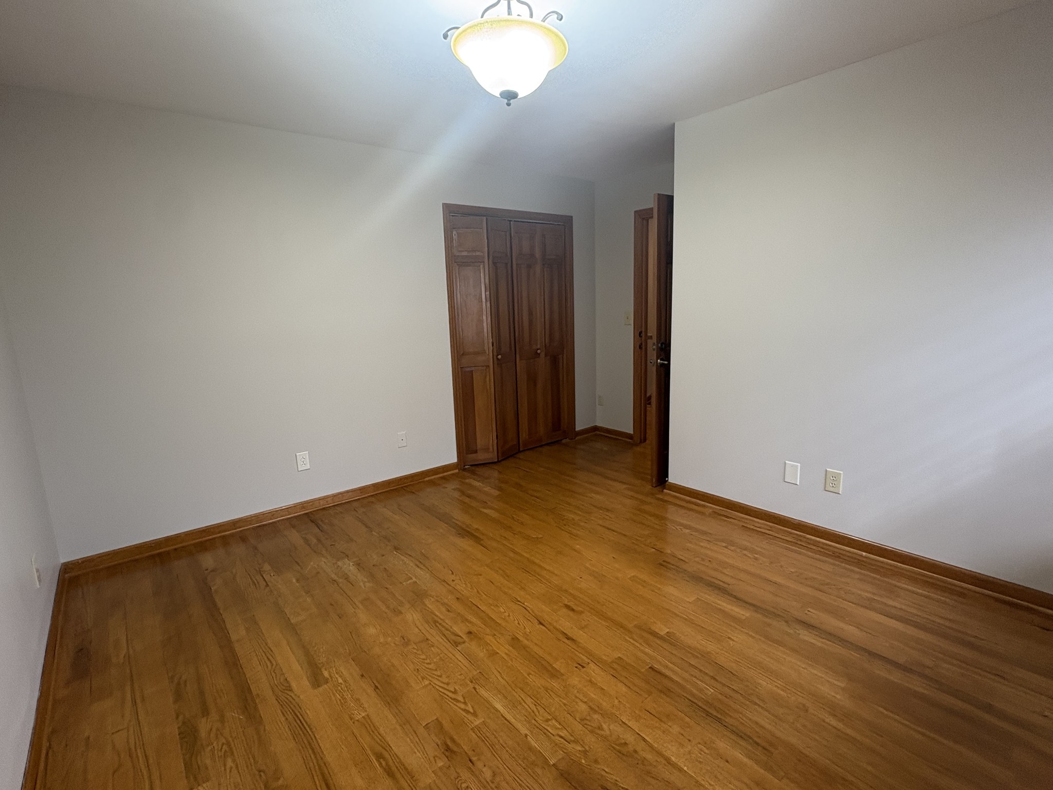 703 12 Oaks Road Tullahoma, TN 37388 - Photo 27 of 46 a view of an empty room with wooden floor
