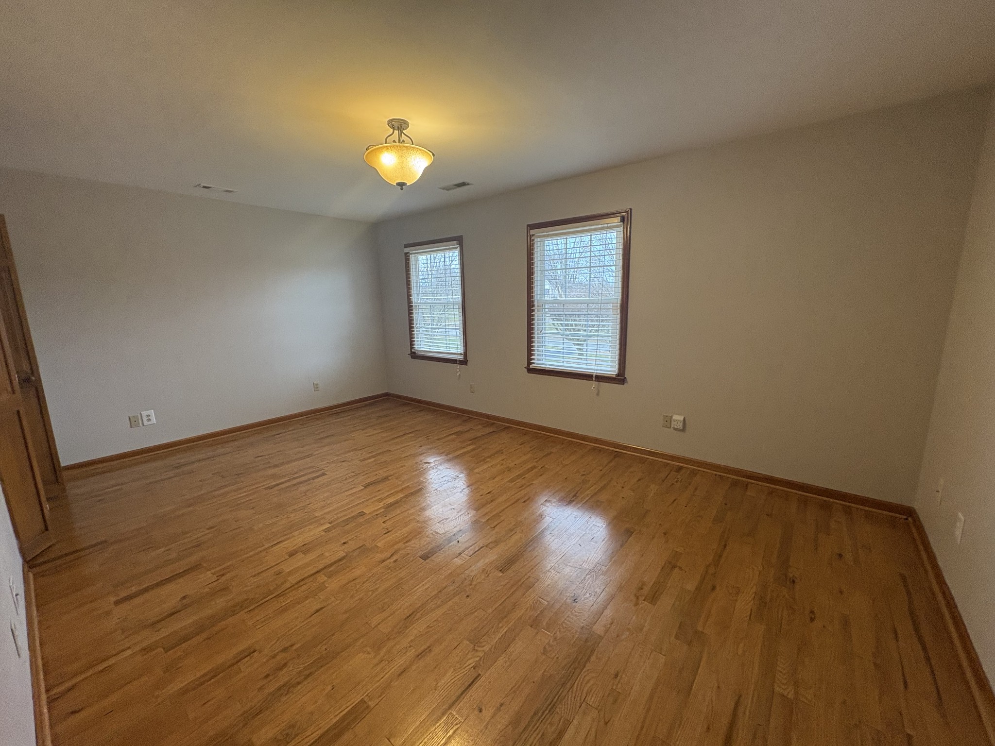 703 12 Oaks Road Tullahoma, TN 37388 - Photo 29 of 46 an empty room with windows