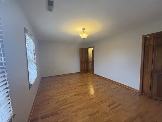 an entryway with wooden floor
