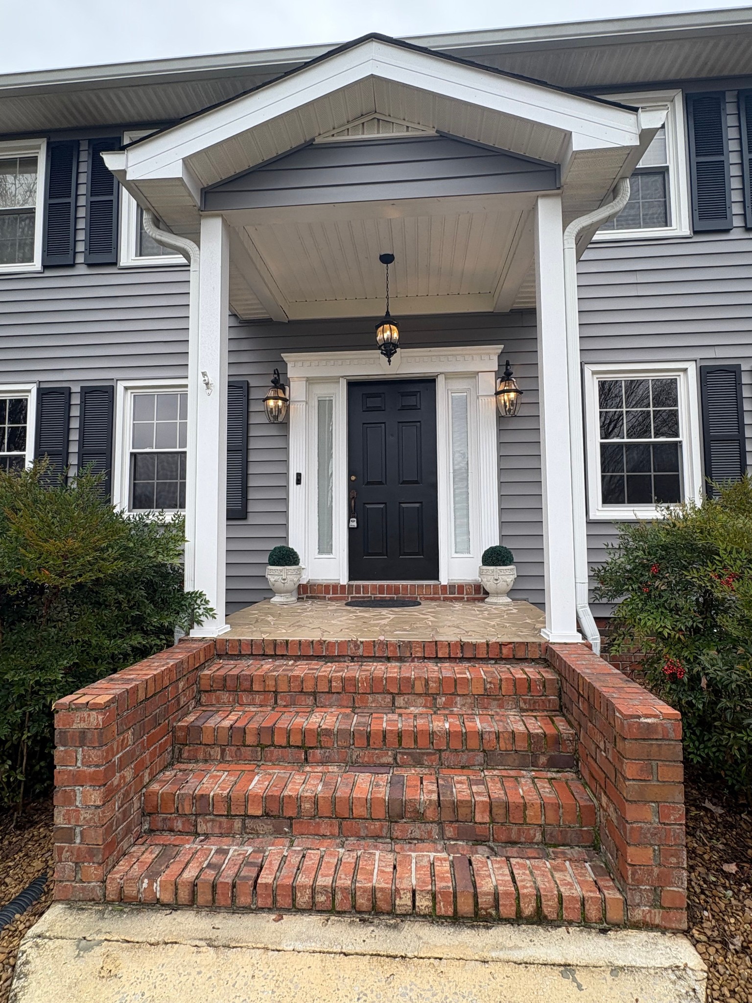 703 12 Oaks Road Tullahoma, TN 37388 - Photo 3 of 46 a front view of a house with a yard