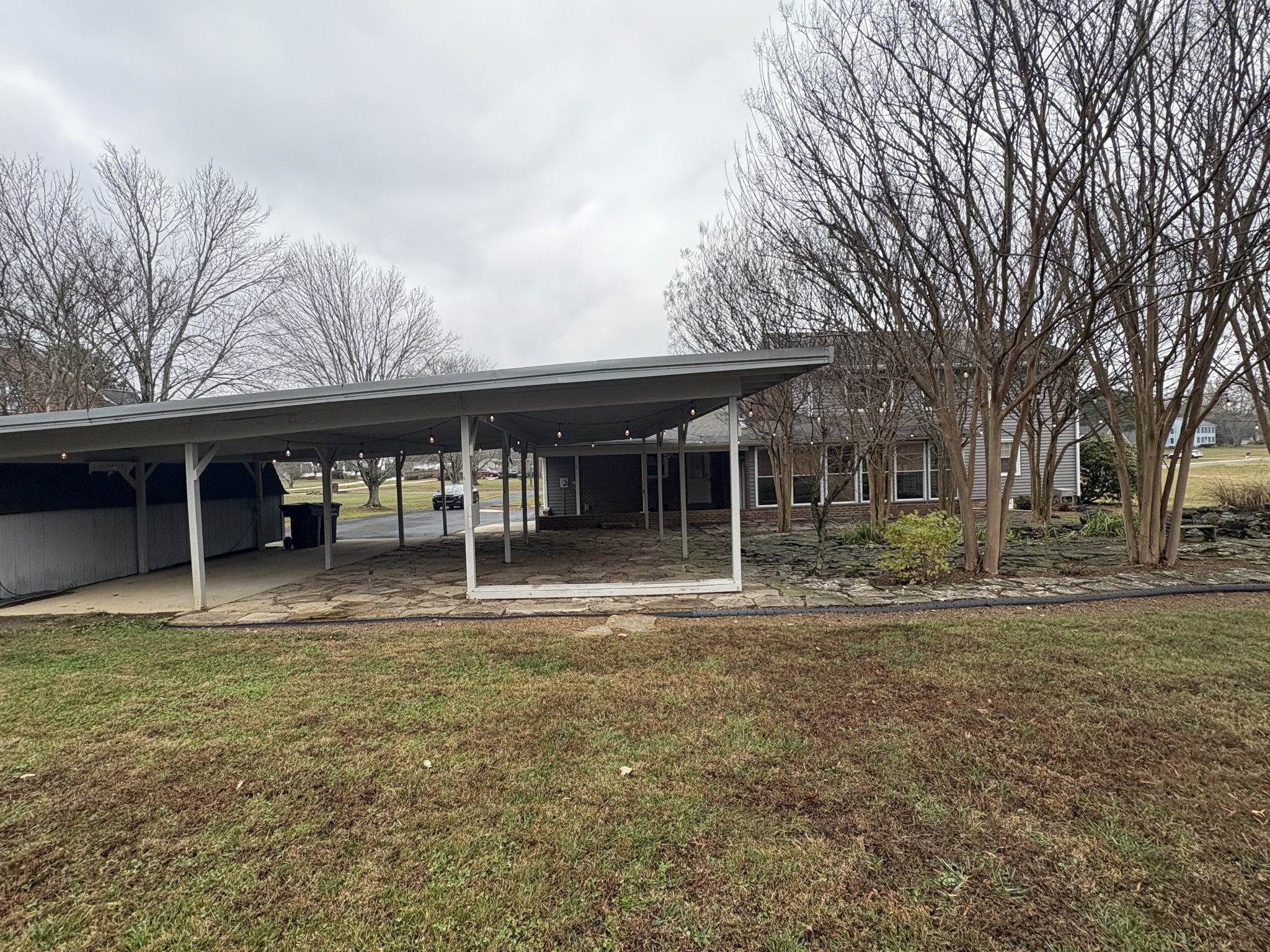 703 12 Oaks Road Tullahoma, TN 37388 - Photo 46 of 46 a front view of a house with garden