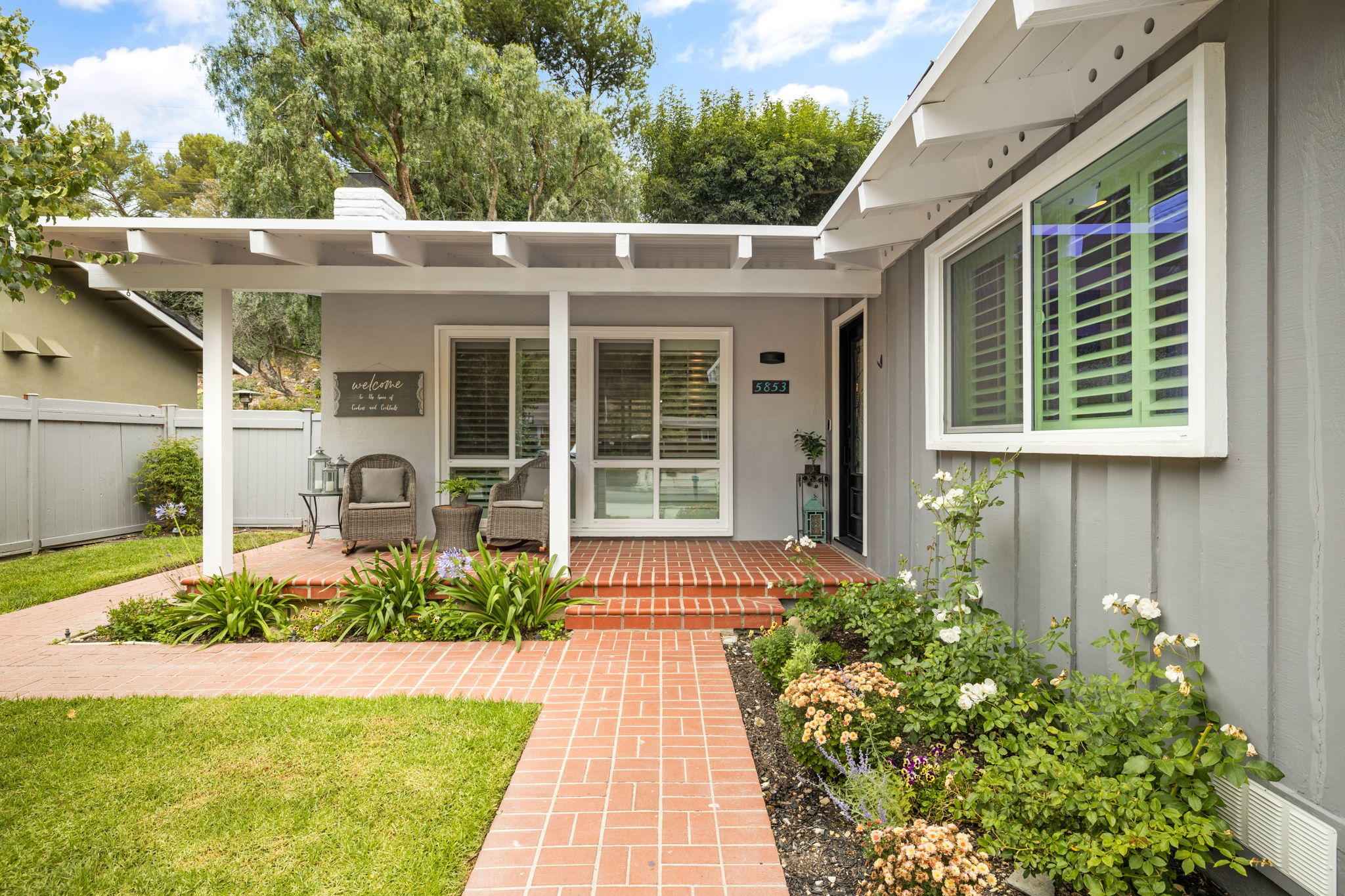 5853 Flambeau Road Rancho Palos Verdes, CA 90275 - Photo 2 of 32 a view of a house with potted plants and a fountain