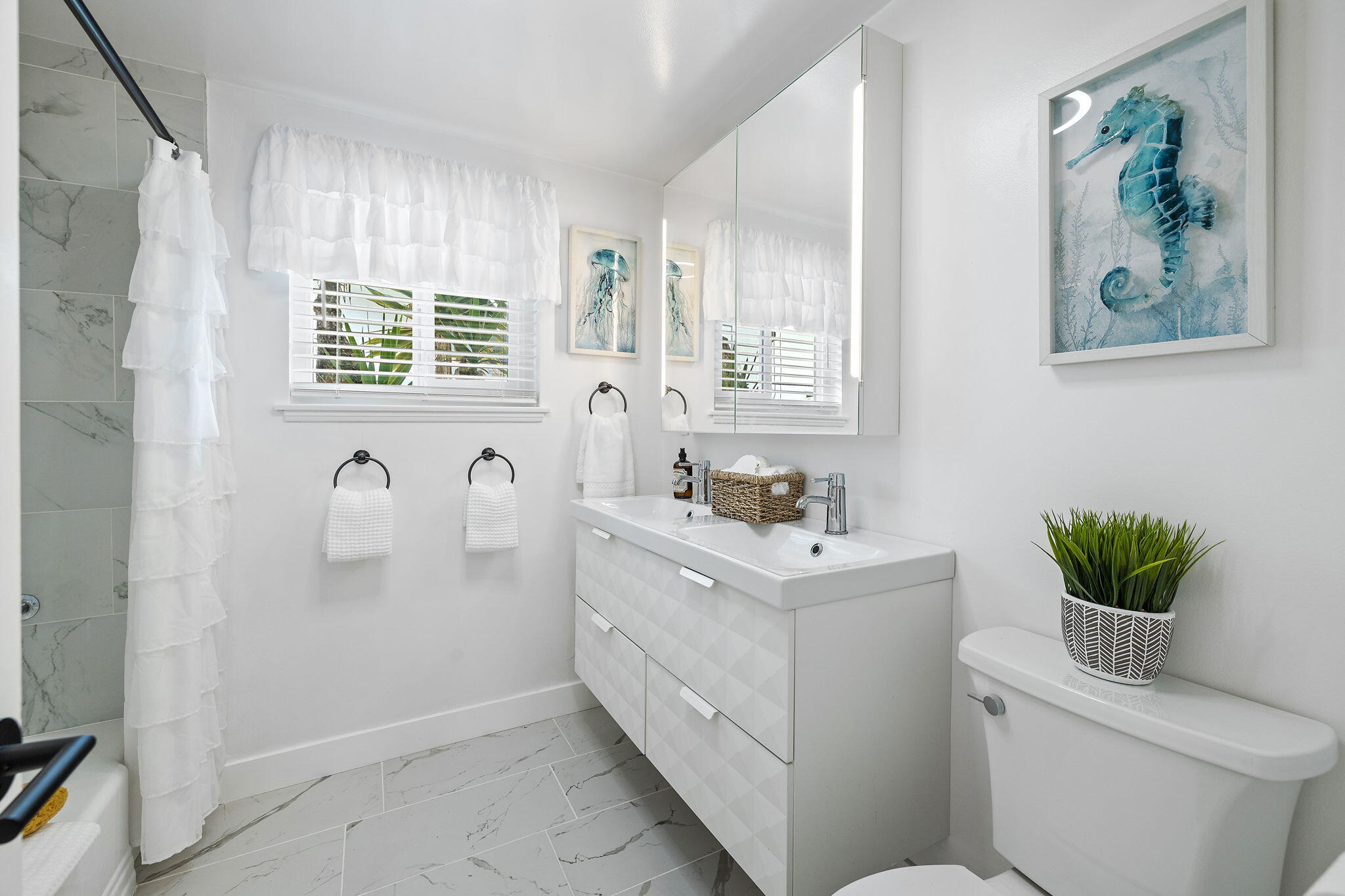 5853 Flambeau Road Rancho Palos Verdes, CA 90275 - Photo 19 of 32 a bathroom with a sink a toilet and mirror