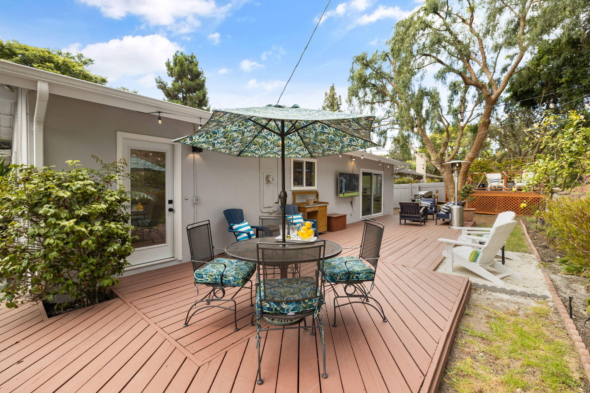 5853 Flambeau Road Rancho Palos Verdes, CA 90275 - Photo 28 of 32 a view of a patio with table and chairs potted plants with wooden floor