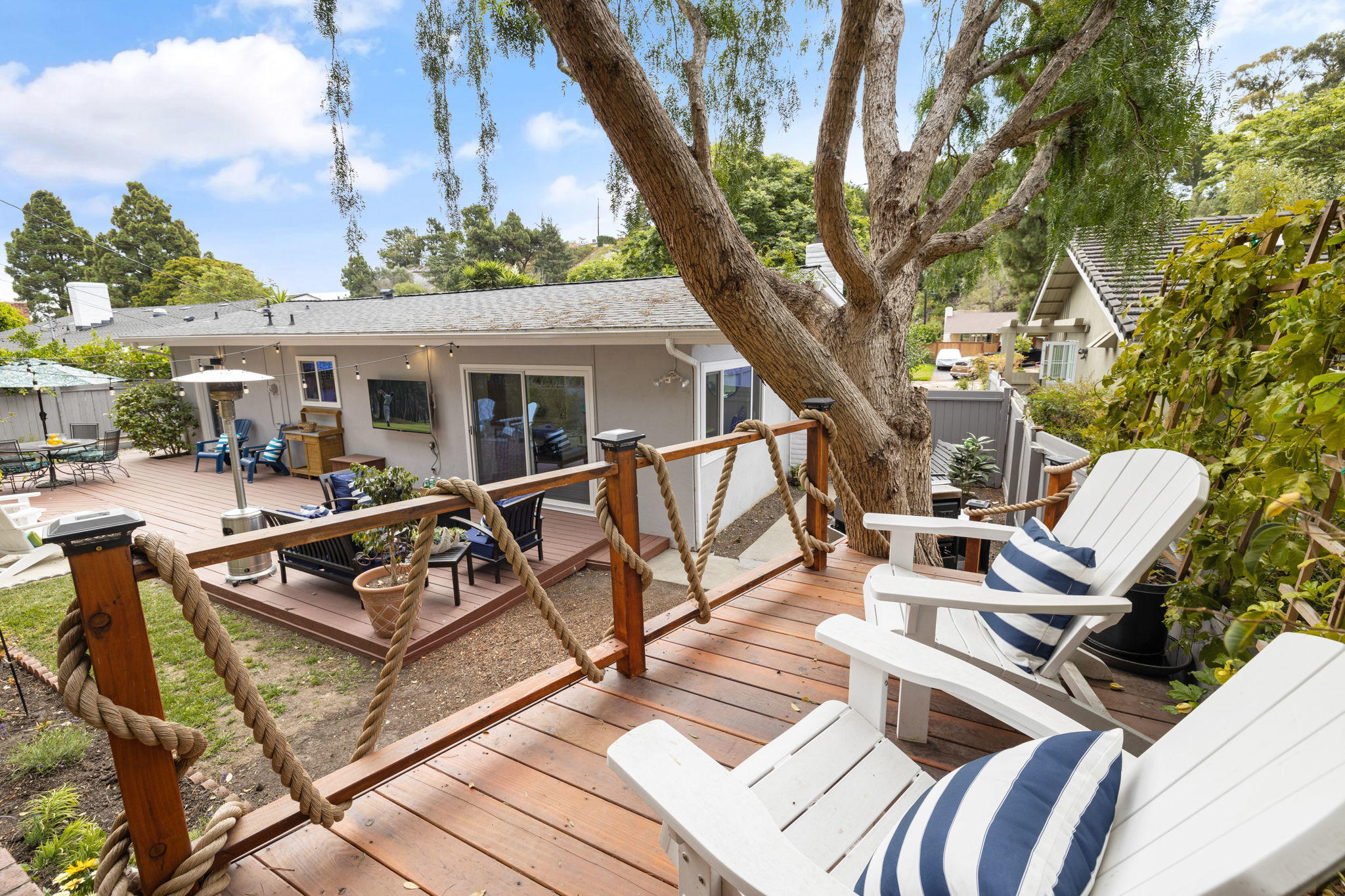 5853 Flambeau Road Rancho Palos Verdes, CA 90275 - Photo 31 of 32 a view of a patio with couches table and chairs with wooden fence and floor