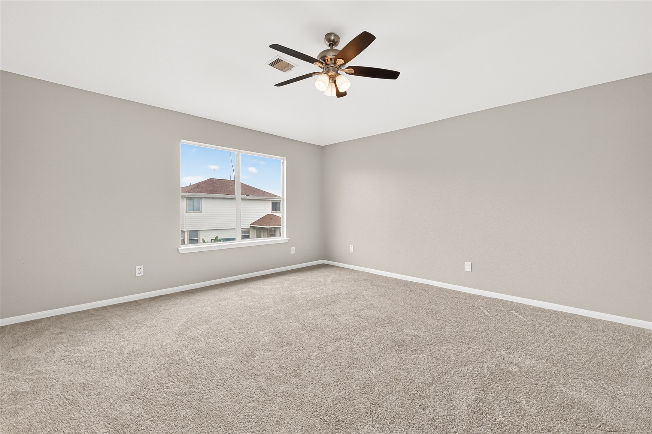 21327 Bella Flora Court Spring, TX 77379 - Photo 43 of 50 an empty room with windows and fan