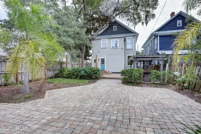 a view of a front of a house with a yard