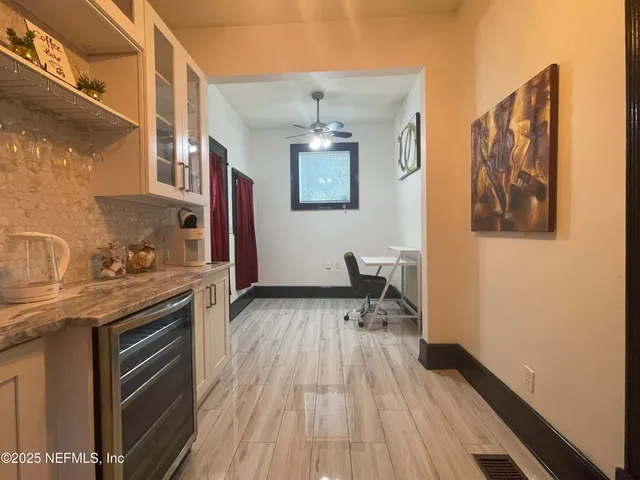 a view of a livingroom with furniture and wooden floor