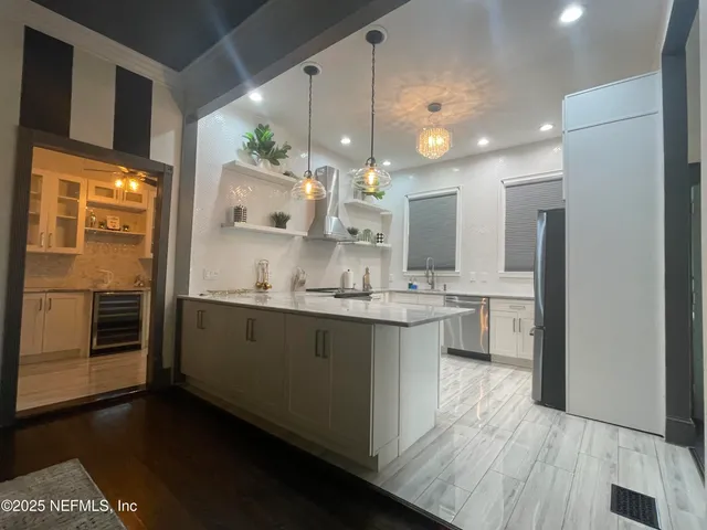 a large bathroom with a large mirror vanity and double vanity