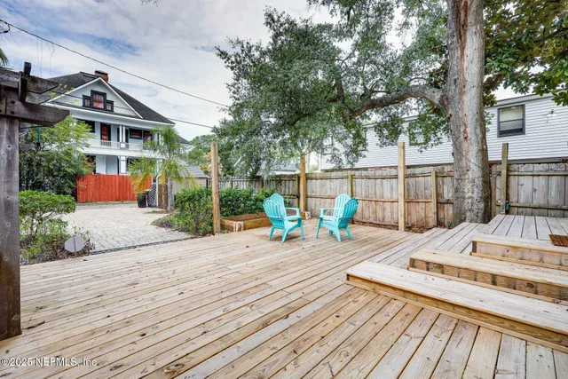 a view of a wooden deck with a patio