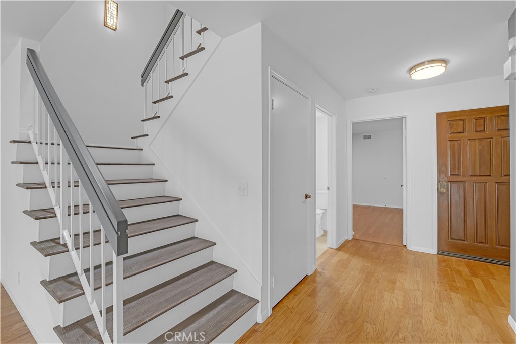 19451 Eagle Ridge Lane Porter Ranch, CA 91326 - Photo 14 of 59 a view of entryway with wooden floor and stairs
