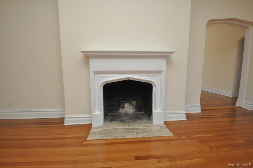155 Garth Road, Unit 5H Scarsdale, NY 10583 - Photo 5 of 30 a living room with a fireplace