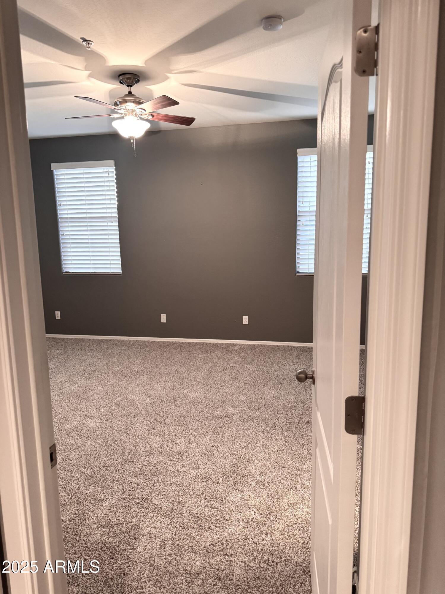 8130 West Groom Creek Road Phoenix, AZ 85043 - Photo 11 of 16 a view of a livingroom with an empty space