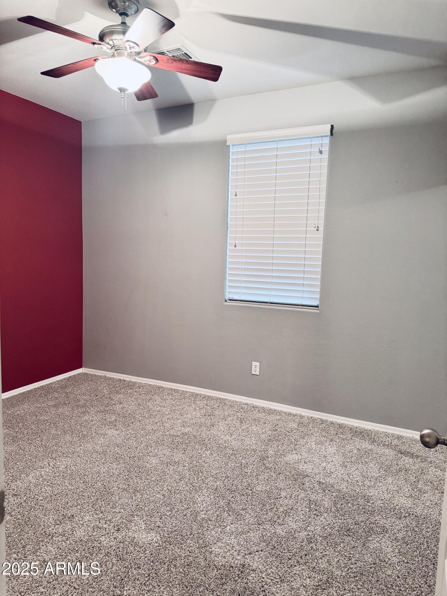 8130 West Groom Creek Road Phoenix, AZ 85043 - Photo 15 of 16 a view of an empty room with a window