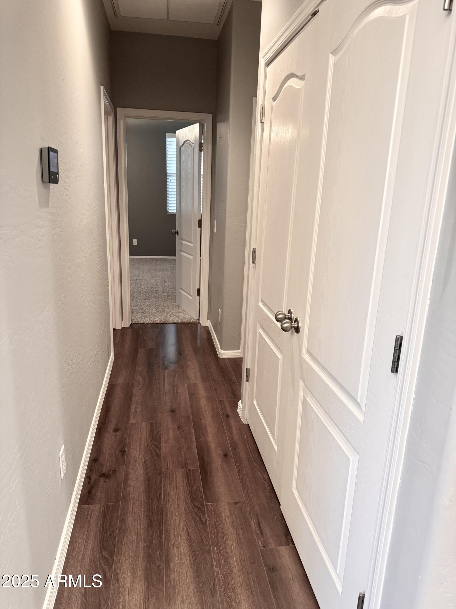 8130 West Groom Creek Road Phoenix, AZ 85043 - Photo 9 of 16 a view of a hallway with wooden floor and staircase