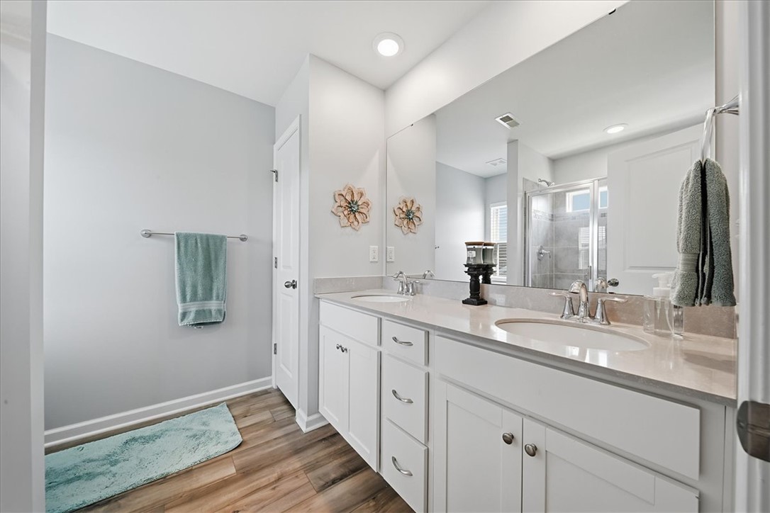 208 Grassy Creek Way Pendleton, SC 29670 - Photo 28 of 43 Dual vanities with polished fixtures and a spacious mirror create a functional, modern bath space.