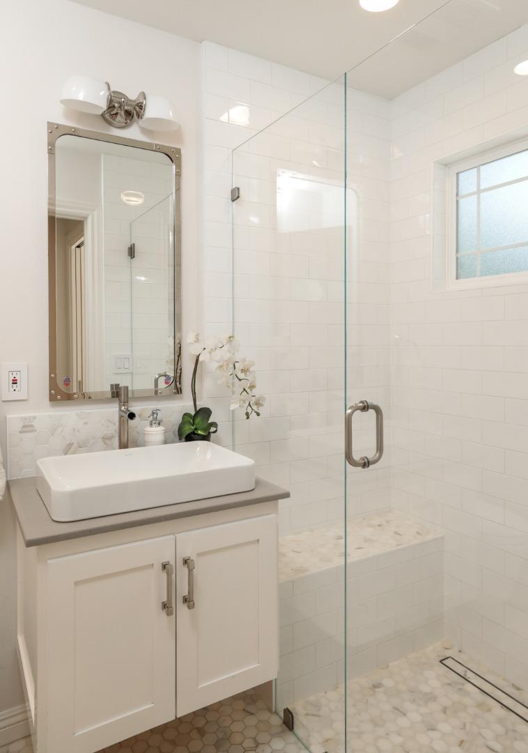 1202 Payne Drive Los Altos, CA 94024 - Photo 14 of 36 a bathroom with a shower sink and mirror