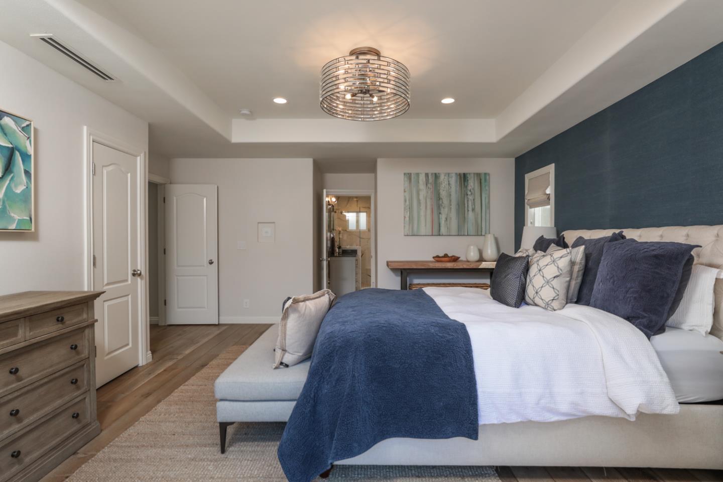 1202 Payne Drive Los Altos, CA 94024 - Photo 16 of 36 a spacious bedroom with a bed mirror and window