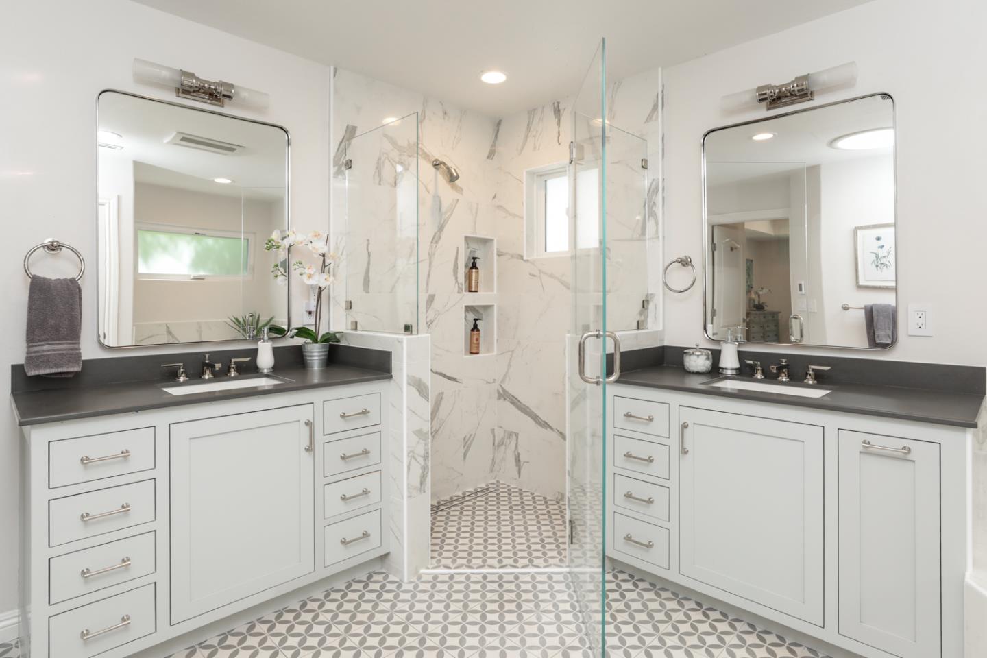 1202 Payne Drive Los Altos, CA 94024 - Photo 17 of 36 a bathroom with a granite countertop sink two mirror and a shower