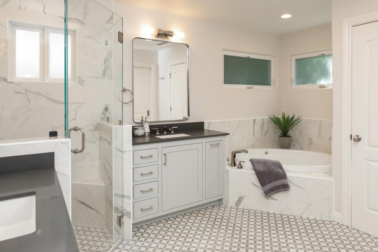 1202 Payne Drive Los Altos, CA 94024 - Photo 18 of 36 a bathroom with a bathtub sink vanity and mirror