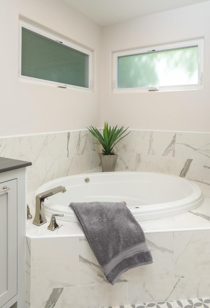 1202 Payne Drive Los Altos, CA 94024 - Photo 19 of 36 a bath tub sitting in a bathroom next to a white sink