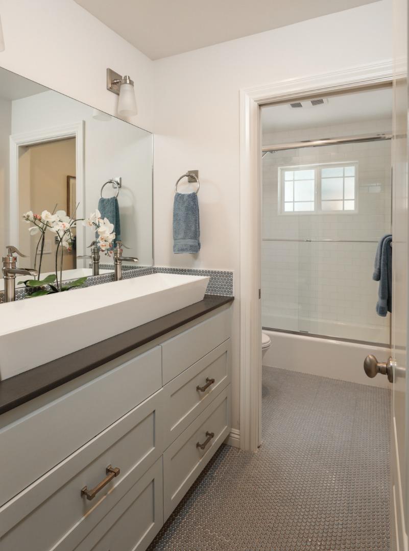 1202 Payne Drive Los Altos, CA 94024 - Photo 22 of 36 a bathroom with a double vanity sink a mirror and shower