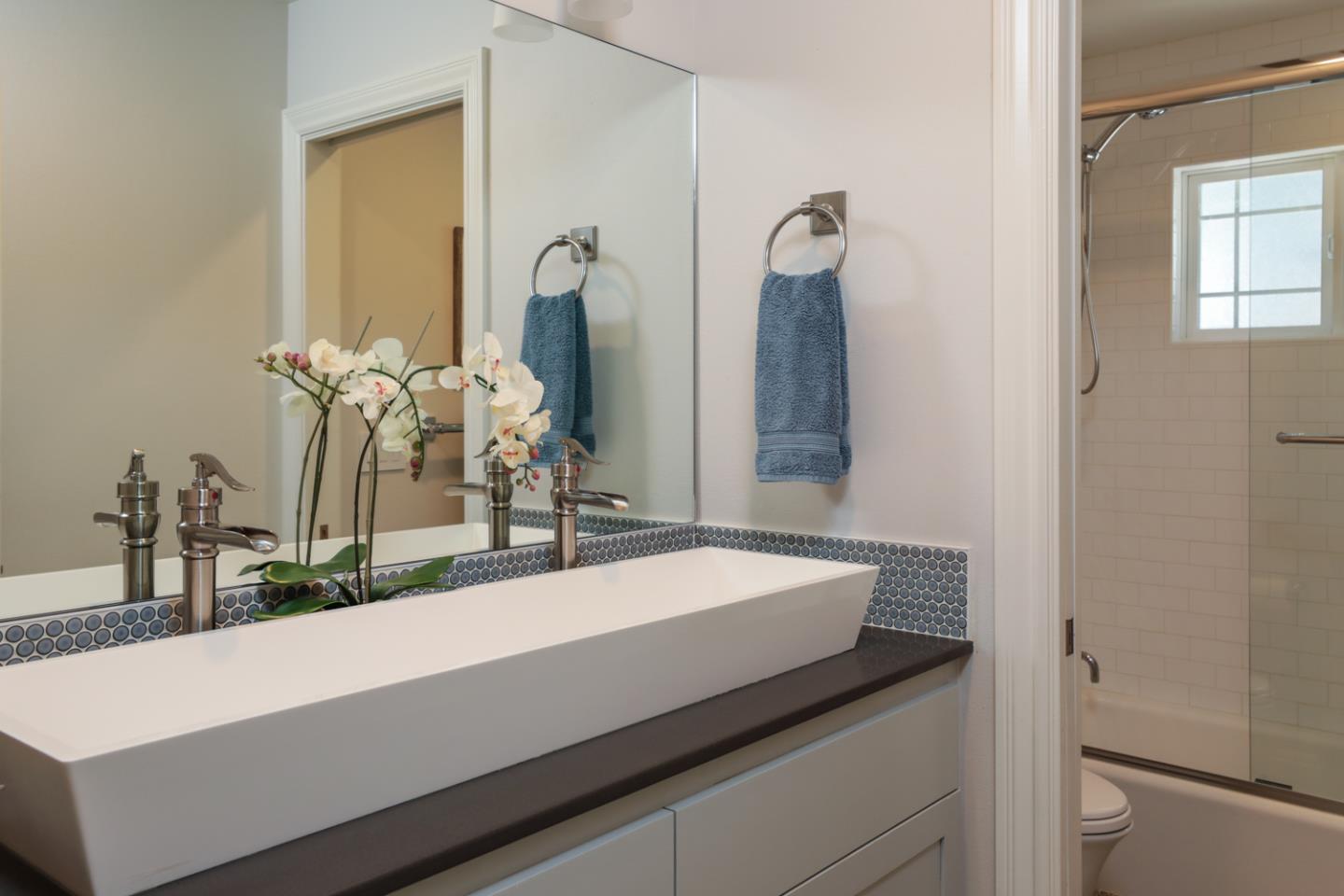 1202 Payne Drive Los Altos, CA 94024 - Photo 23 of 36 a bathroom with a sink and a mirror
