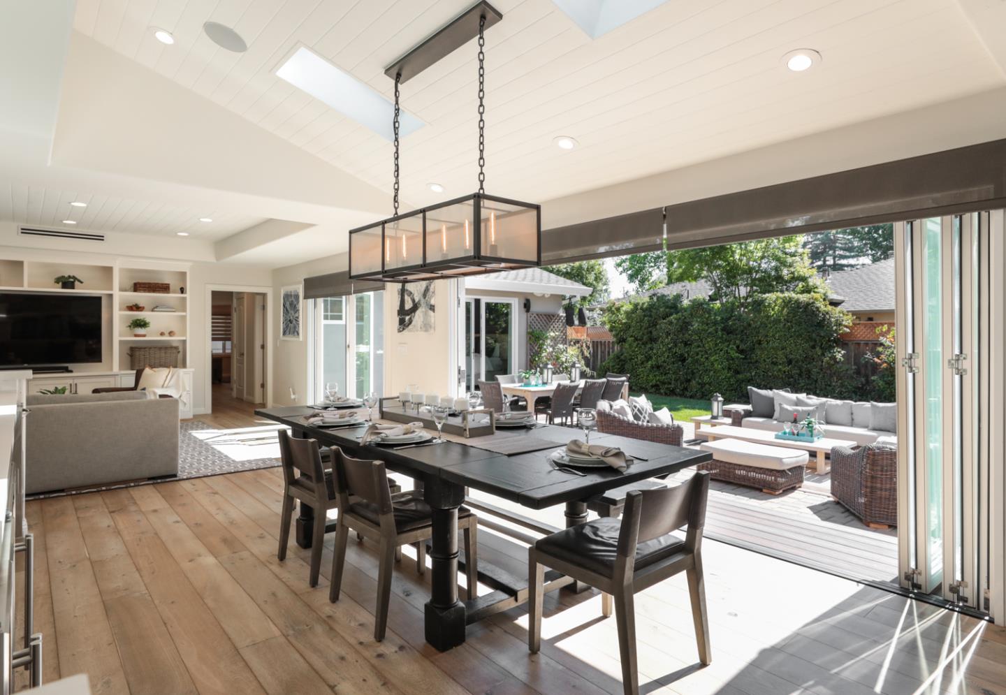 1202 Payne Drive Los Altos, CA 94024 - Photo 3 of 36 a view of a dining room and livingroom with furniture wooden floor a chandelier