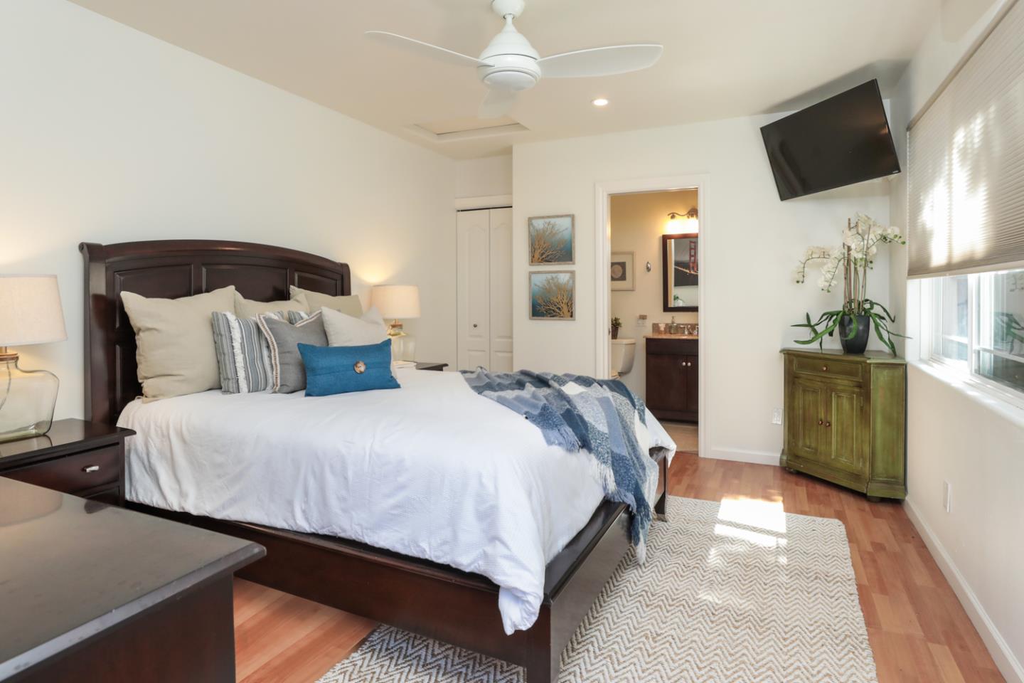 1202 Payne Drive Los Altos, CA 94024 - Photo 31 of 36 a bedroom with a bed a flat screen tv and dresser